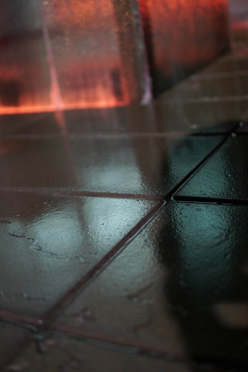 Reflections on wet tiles at night